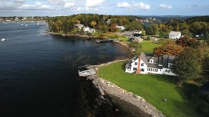 A view of the house and neighboring cottages.