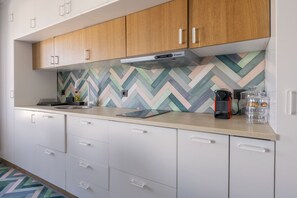 Modern Kitchen with white cabinets and stove
