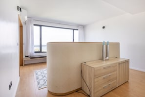 This living room features a dresser with drawers, providing additional storage space for your belongings.
