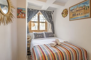 Spacious Bedroom: Luxuriate in comfort with a king-sized bed
