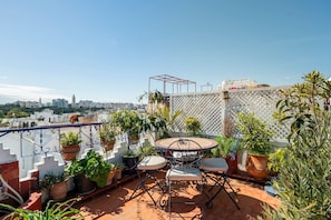 Relax and unwind on your private balcony featuring a table and chairs, perfect for enjoying a cup of coffee or a glass of wine in the fresh air.

