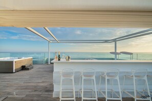Rooftop bar and jacuzzi.