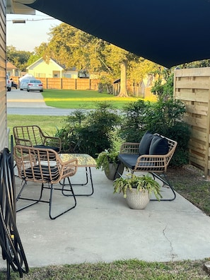 Exterior Front side patio w/ shade sail cover
