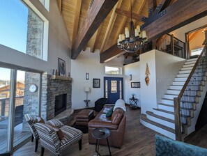 Main entry on 2nd floor with large windows and deck access.