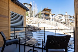 - Start your day with coffee and crisp mountain air from your private patio
- Kick back on comfy chairs while soaking up the charm of snowy hillside views
- Perfect spot for après ski chats, stargazing, or that Instagram worthy snap
