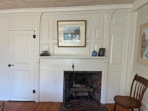 240+ year old fireplace in dining room.