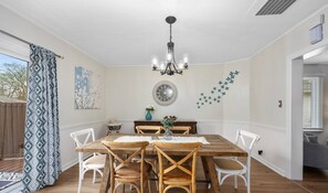 Dining area with additional chairs and portable table for 14 guest.