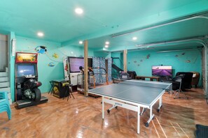 Awesome game room with arcade games and ping pong.