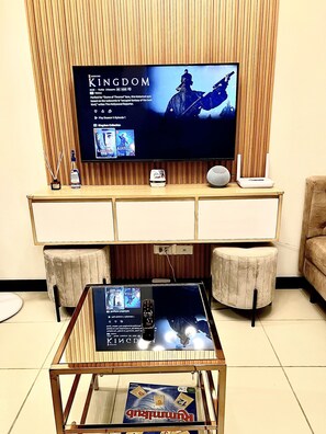 Step into a modern minimalist living space with a Smart TV for entertainment.
