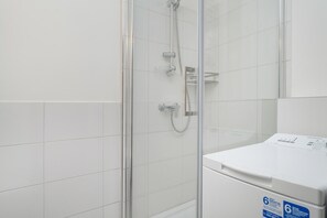 Comfortable bathroom with hairdryer. 