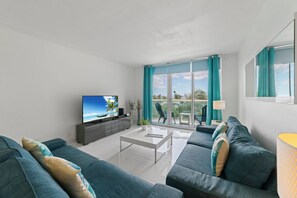 Bright living space with ample seating and TV