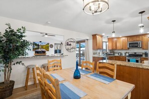 Dining seats 6 and ask for leaf if you need it to seat 2 more.  Seating at bar height area seats 3 with peek-a-boo to sunroom where you can watch with 65" Roku TV, and use the peloton bike.  Great open kitchen/ dining area near the sunroom.