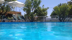 Unwind in the serene swimming pool, ideal for relaxation and rejuvenation