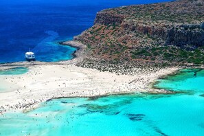Balos Beach with crystal-clear waters (130km).