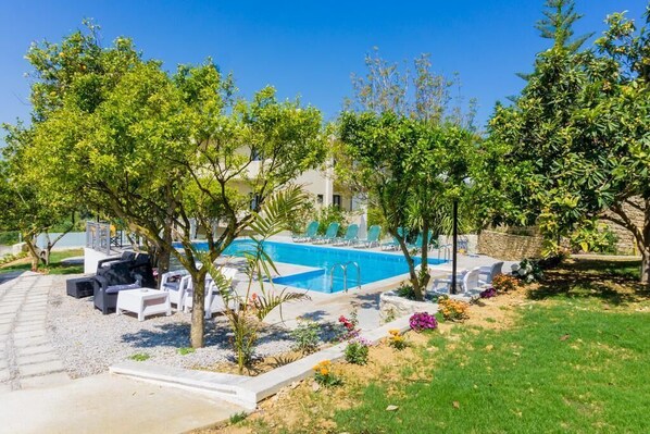 Immerse yourself in the tranquil beauty of the property's garden and swimming pool