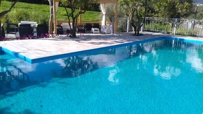 Unwind in the serene swimming pool, ideal for relaxation and rejuvenation