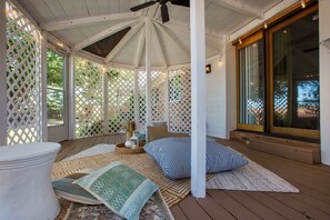 Gazebo lounge space with cozy seating and serene surroundings