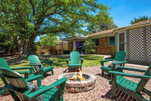 Patio with firepit and 6 adirondack chairs