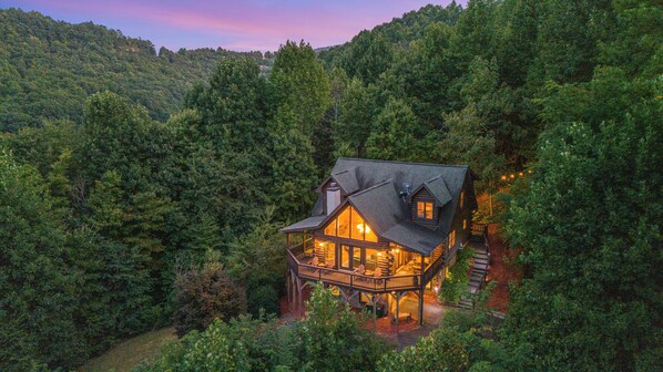 Charming cabin nestled in the lush forest, offering serene escape. 