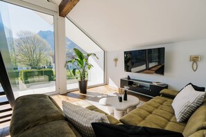 Living room with direct view of Swiss alps