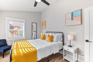 Enjoy a welcoming bedroom with natural sunlight, creating a serene atmosphere.