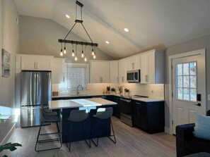 Open layout Kitchen/dining/living room all together.