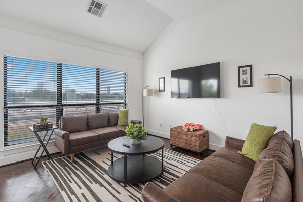 Living room with City skyline views!  50 Inch Roku TV and seating for 6.
