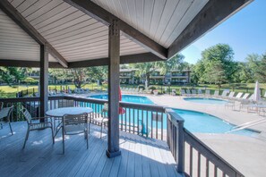 Your outdoor oasis, featuring pool, hot tub, and plenty of seating