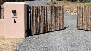 The entire perimeter of property is fenced. A security code opens the gate.