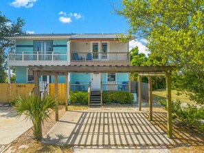 The semi-covered portico covers the dedicated private parking in front of the townhouse.