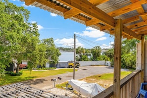 The balcony offers a captivating view of the lively street below, adding a touch of urban charm to the ambiance.
