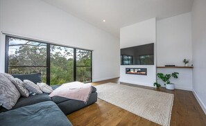 Living room one - incredible views, flat screen TV, gas fire and ample seating.