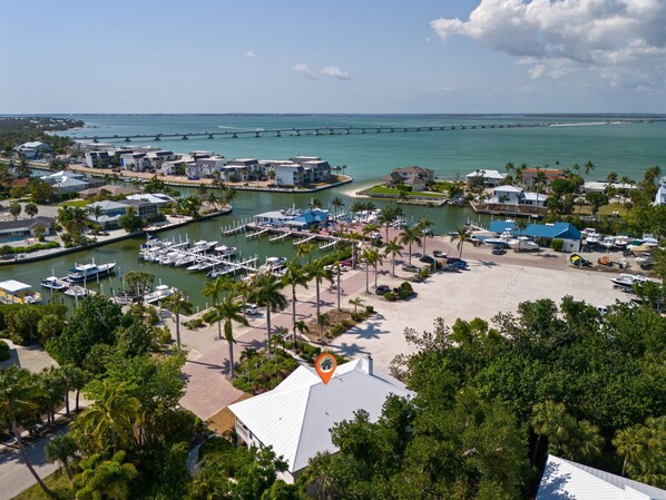 Situated directly inside of the Sanibel Marina, this incredibly unique property has been called home by all past owners of the Sanibel Marina, including Grandma Dot herself