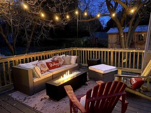 Ignite your evenings by the fire while enjoying twinkling lights and comfy seating!