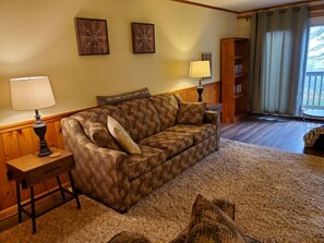 The living room features a full size couch with pull-out couch, love seat and recliner (not pictured).   Smart tv is set-up for logging into your favorite streaming services, watch DVD's provided, or hook-up your favorite gaming system!