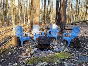 Our backyard has firepit with chairs