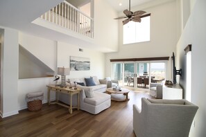 The spacious living room offers plenty of space for the whole family to spread out and relax.