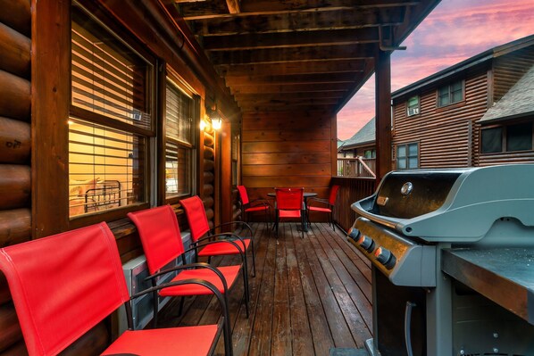 Basement level deck provides a dining table and chairs, as well as a BBQ grill with hardlined propane.  No running out of propane!