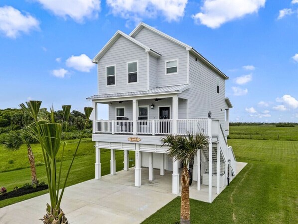 Beautiful home overlooking farm land behind you and a bird sanctuary to your left!