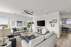A sofa pulls out into a Queen Size Sleeper!  Large Smart TV and lots of games!