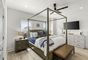 The primary bedroom is beautiful and comfortable with it's king size bed and plush linens!  Enjoy your favorite show on the Smart TV!