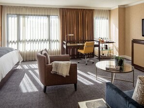 A spacious lounge area with a view, where elegance and comfort create an inviting urban oasis.