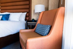 A cozy corner for relaxation, featuring a plush chair that beckons for a moment of quiet repose.