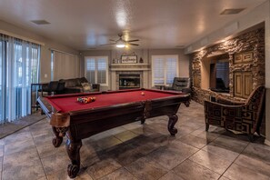 Gather together for a game of pool, a puzzle, or a board game.