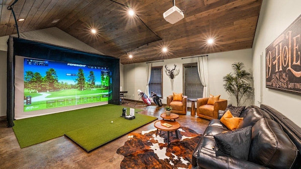 Try out your swing in the Golf Simulator Room