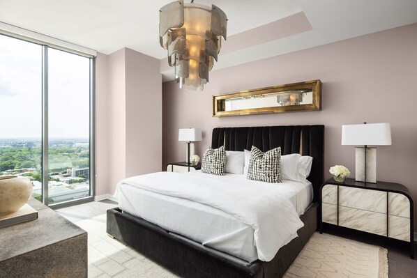Primary suite with a king bed and a 55" 4K UHD TV