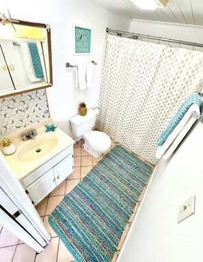 Freshly painted 4 pc bath off kitchen