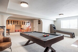 Our basement comes ready to play pool, skee ball, basketball, and foosball!