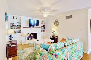Relax in this cozy living room with a good book or catching your favorite show