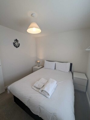 Double bedroom with convenient bedsides and sockets to charge devices overnight.